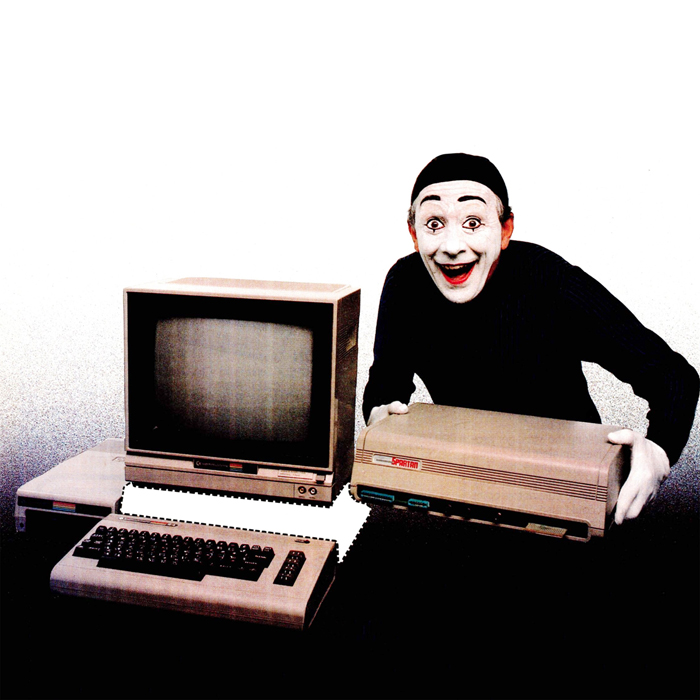 A creepy mime removing the middle part of a computer as if it were a paper cutout