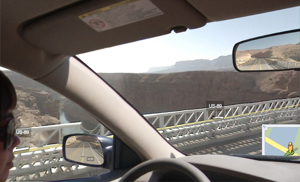 Jenny Odell in her car, with a bridge and canyon photoshopped outside the car windows, and Street View of the road photoshopped into the rearview and side mirrors